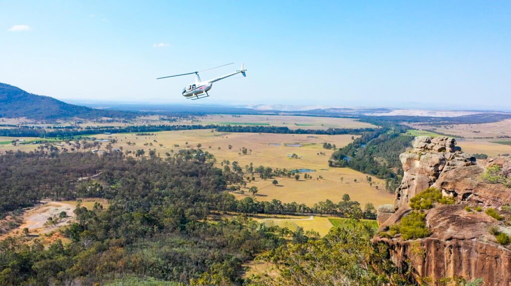 helicopter flying over hunter valley after getting married with wild elopements